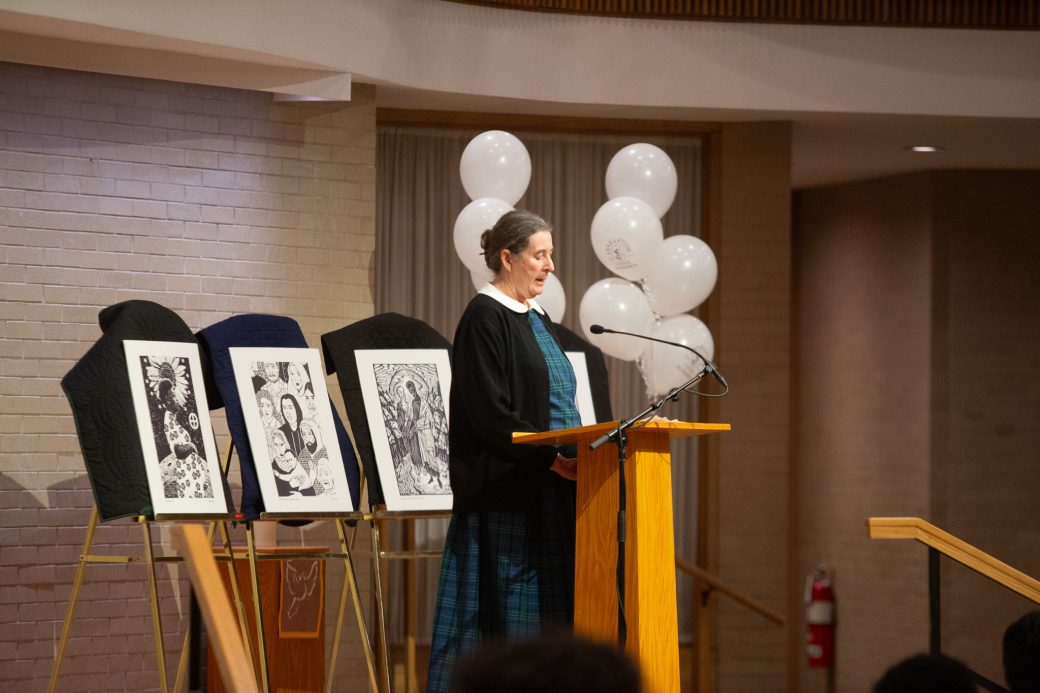 Woman doing a speech at stage's pulpit