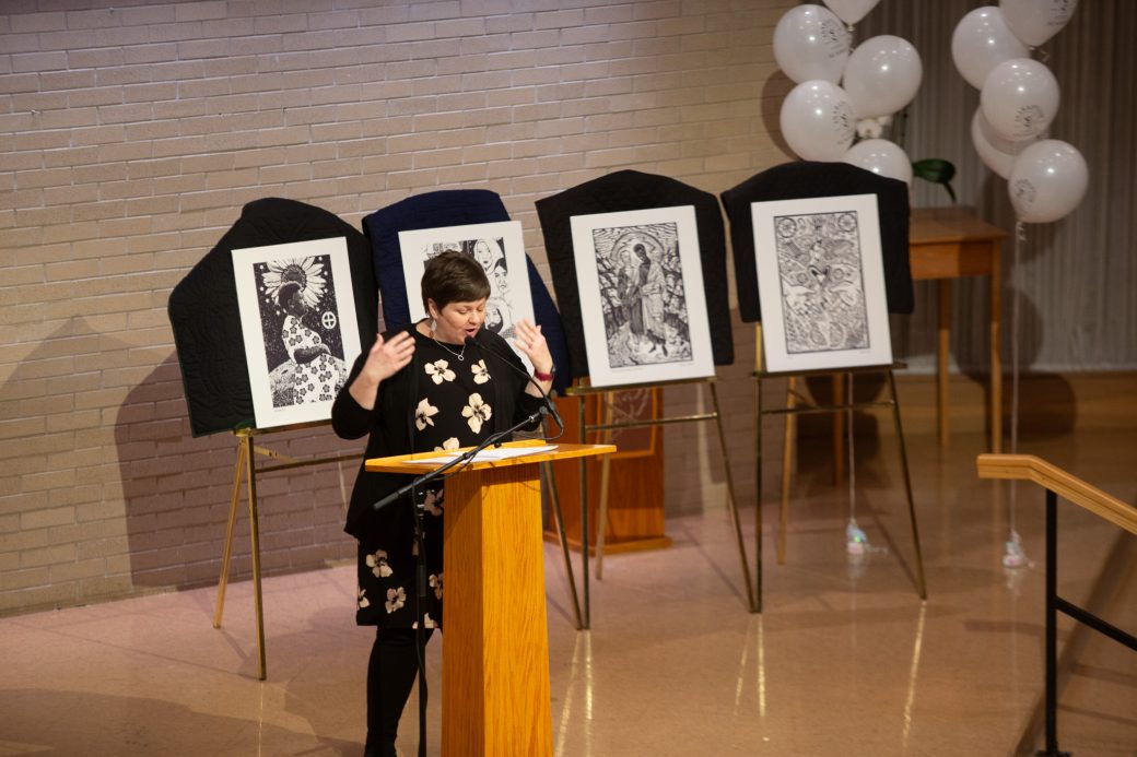Woman doing a speech at stage's pulpit