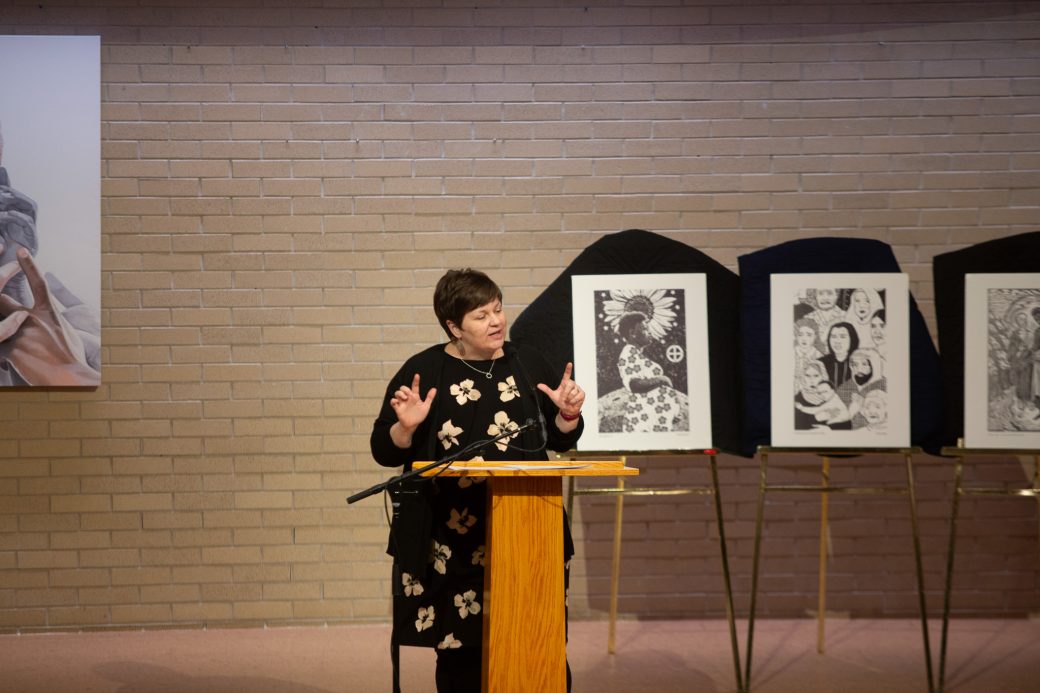 Woman doing a speech at stage's pulpit