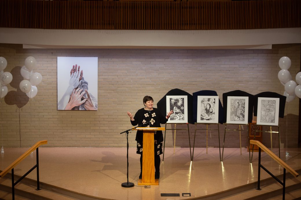 Woman doing a speech at stage's pulpit