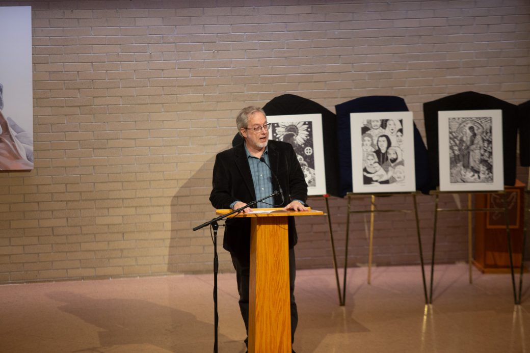 man doing a speech at stage's pulpit