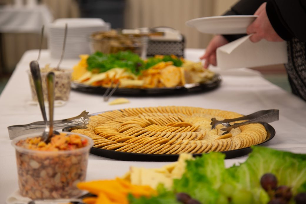 Table with salads and chips in Anabaptism Celebration