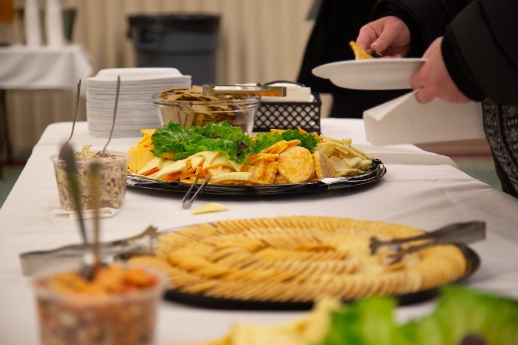 Table with salads and chips at Anabaptism Celebration