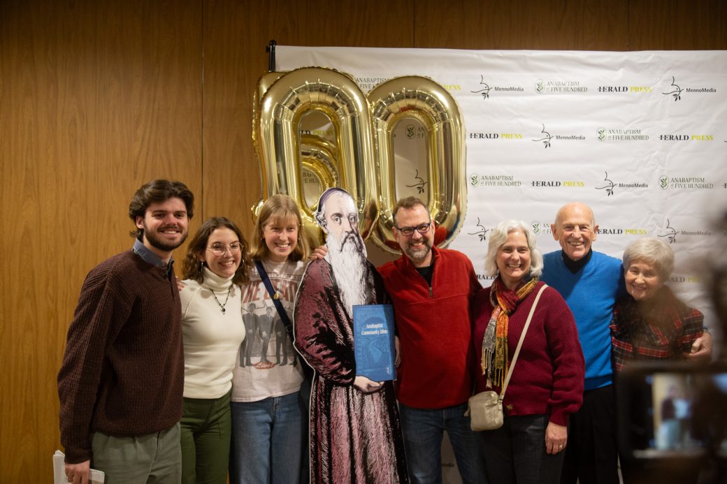 People hugging the Georg Blaurock and smiling to the camera