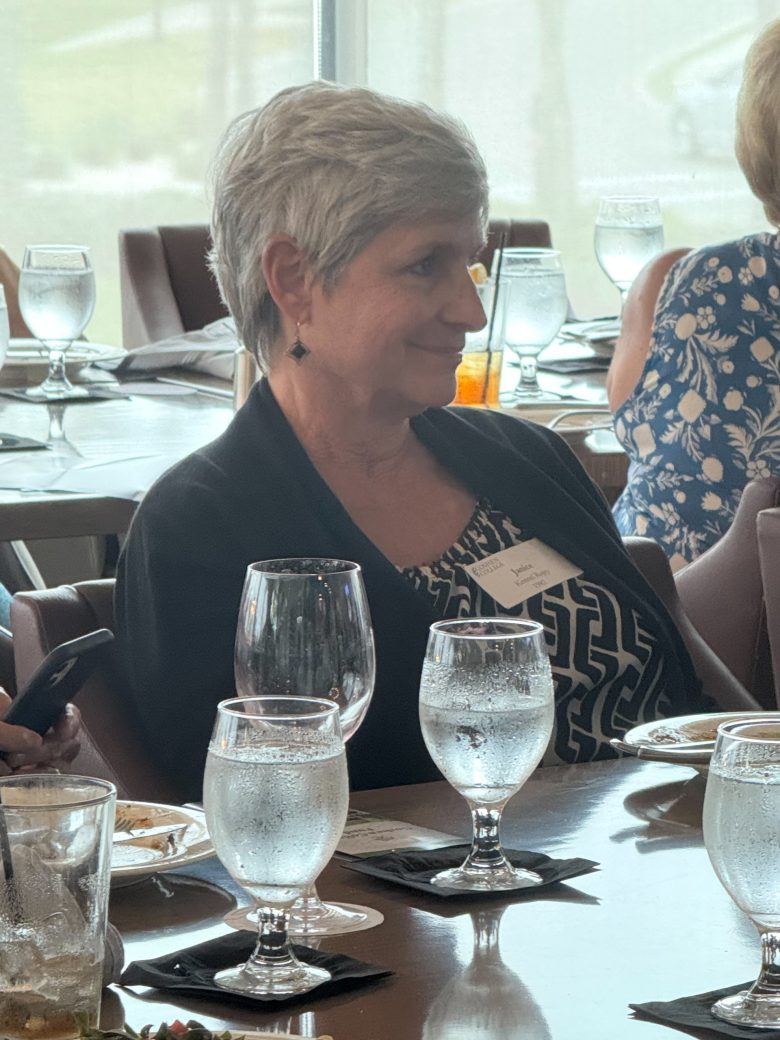 Woman seated at Connected Cause Alumni & Friends Gathering: Sarasota, Florida