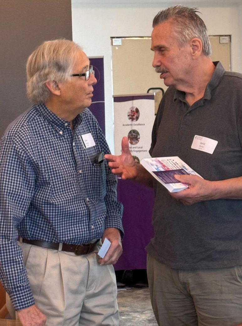 Two men talking at Connected Cause Alumni & Friends Gathering: Sarasota, Florida