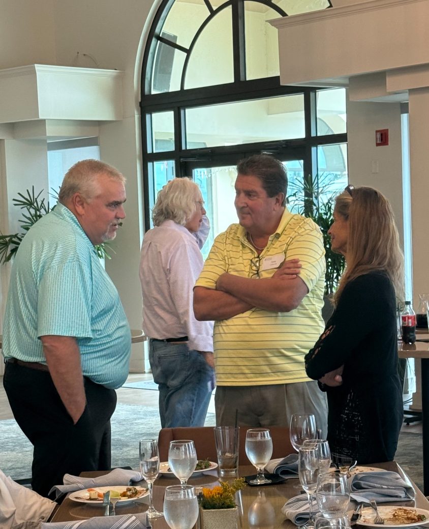 Two men talking at Connected Cause Alumni & Friends Gathering: Sarasota, Florida