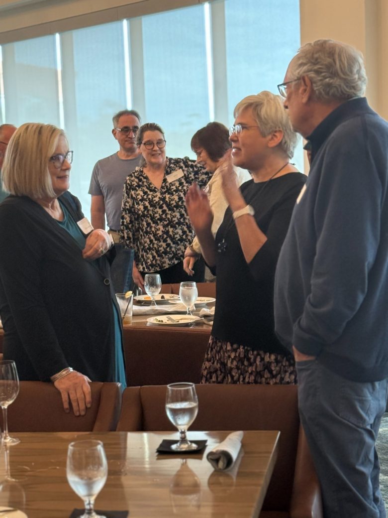 People talking at Connected Cause Alumni & Friends Gathering: Sarasota, Florida