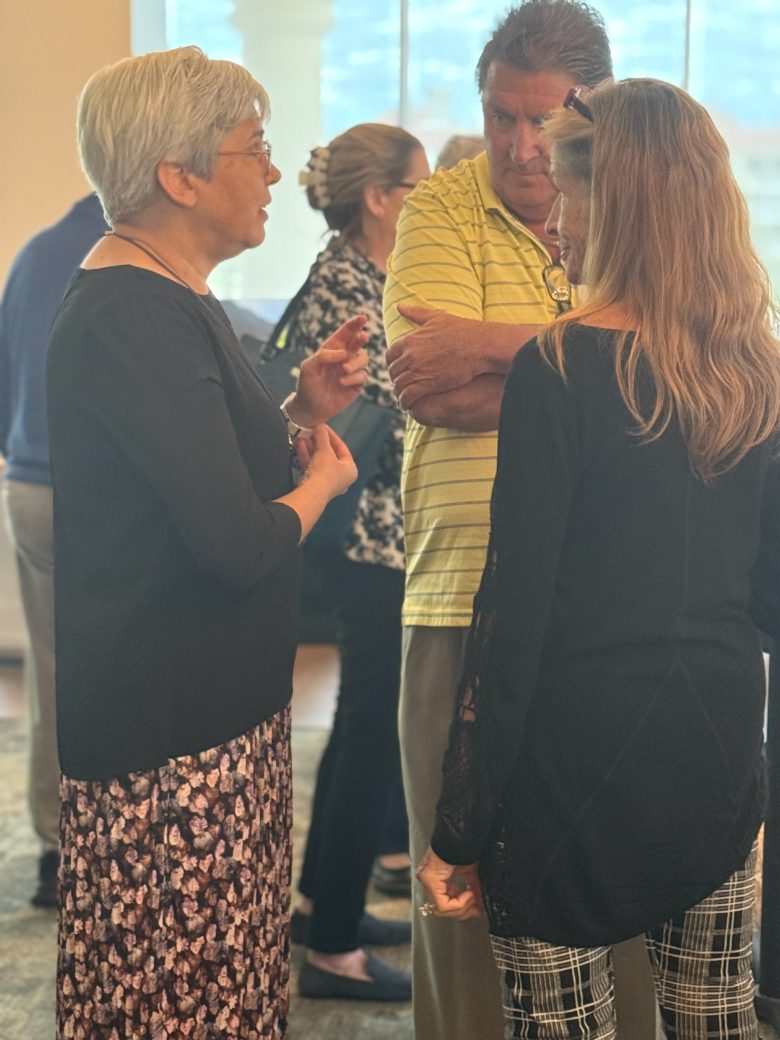 People talking at Connected Cause Alumni & Friends Gathering: Sarasota, Florida