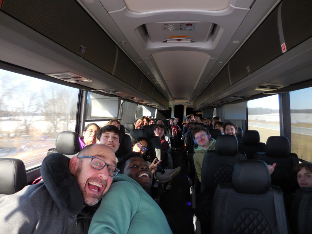 Students of the Goshen college at a bus