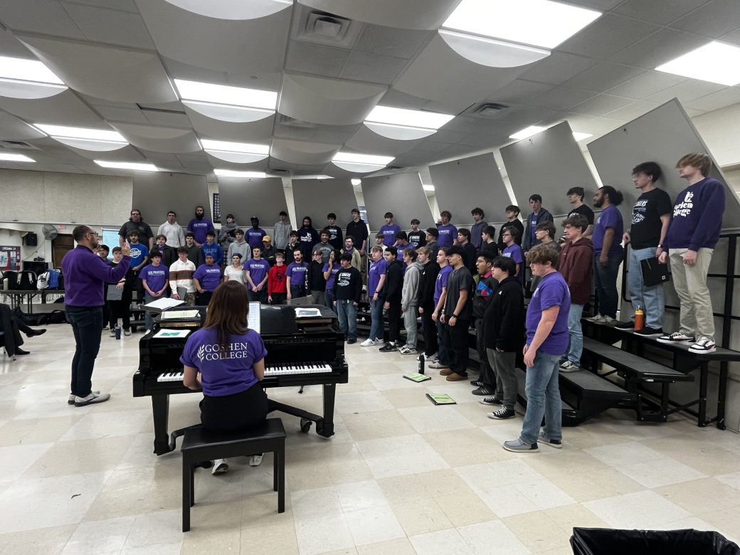 Goshen University students practicing the songs.