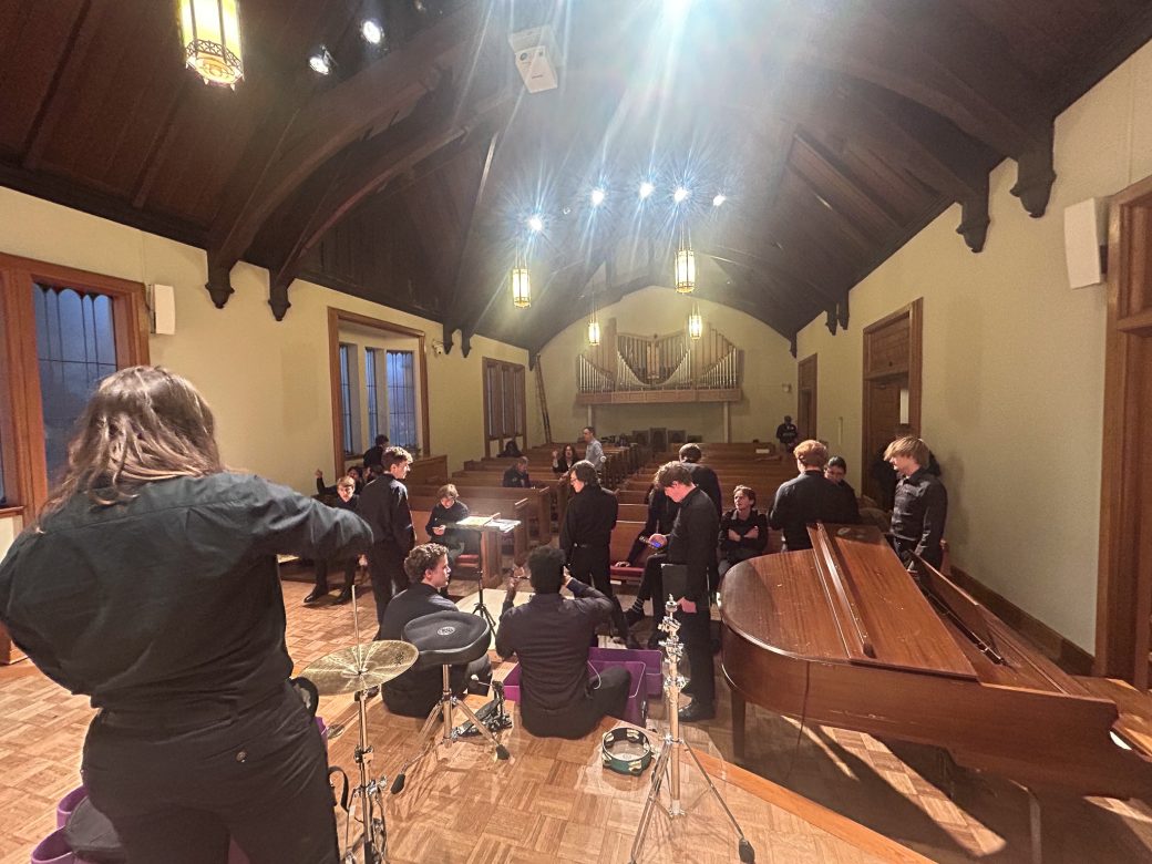 Goshen's college students music choir in a church