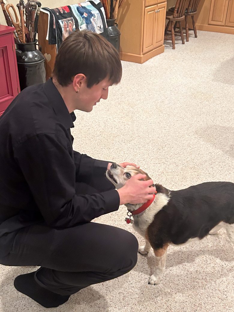Goshen's college student playing with a dog
