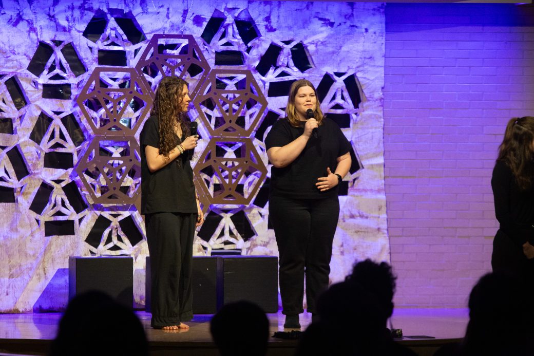 presenters of Goshen Monologues 2025 at the stage one of them is doing a speech