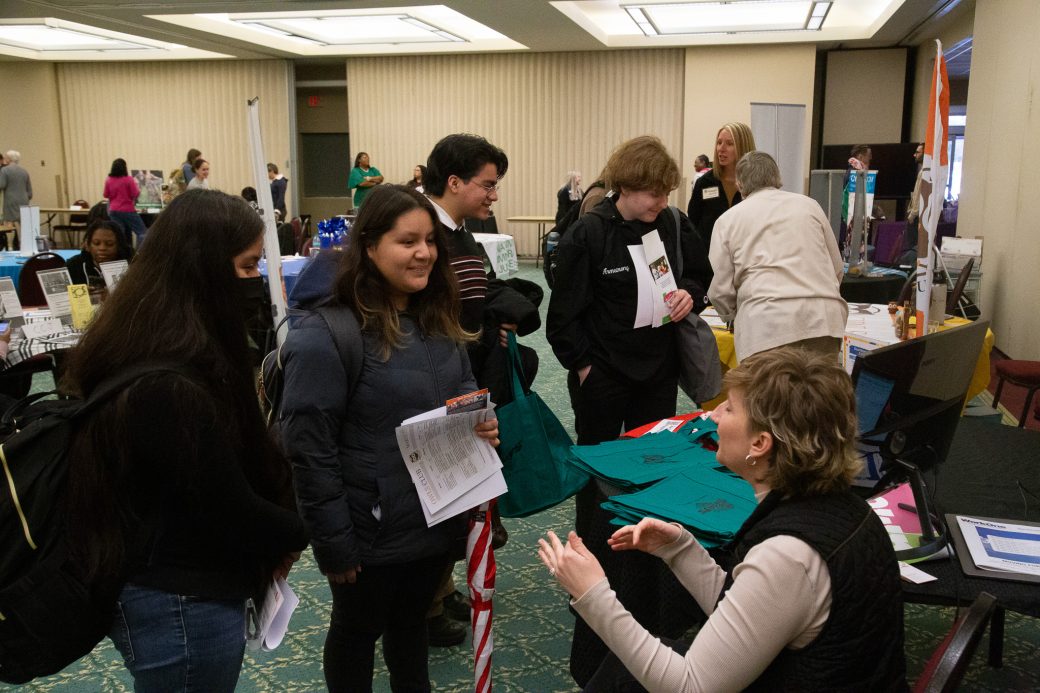 Two women talking at Community Engagement Fair