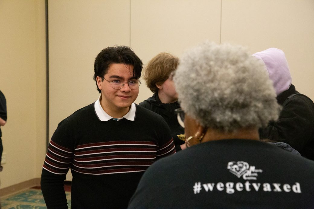 Two men talking at Community Engagement Fair