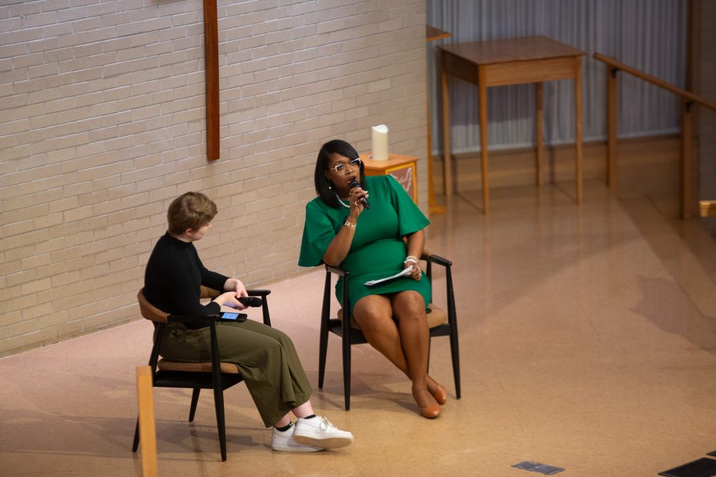 Women seated doing a speech at Community Engagement