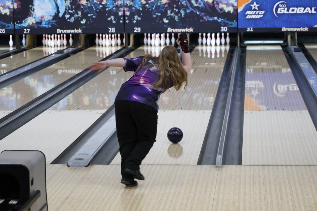 a girl playing bowling