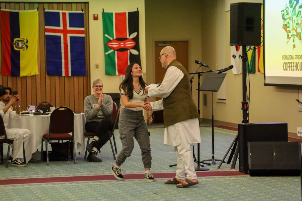 Goshen College student receiving a award for her academic performance