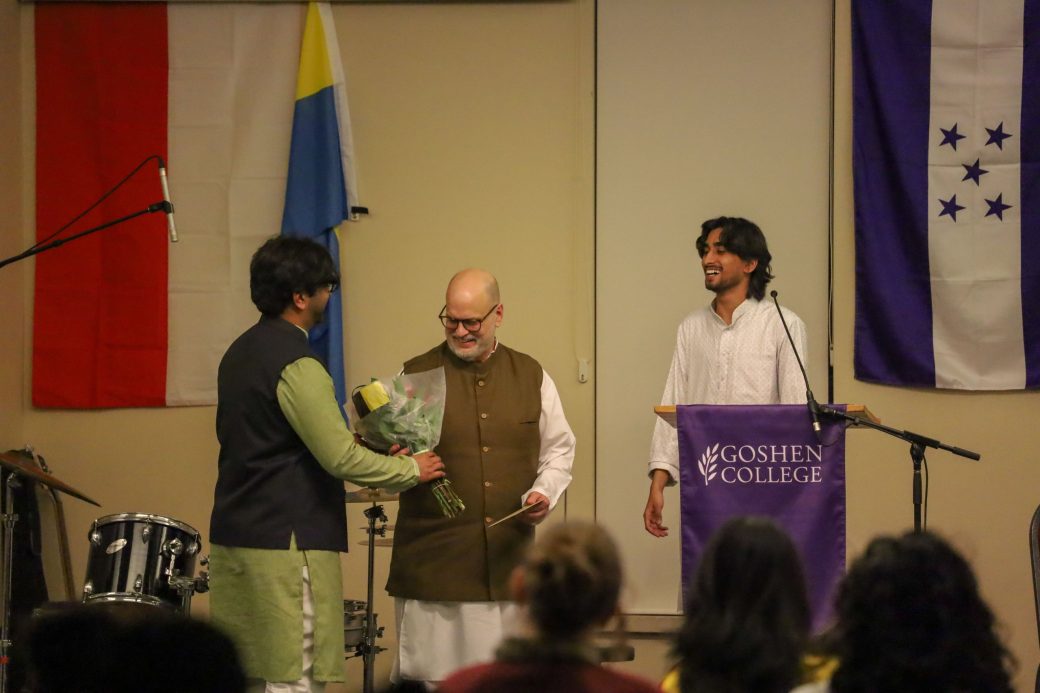Goshen College students smiling with GC International Advisor