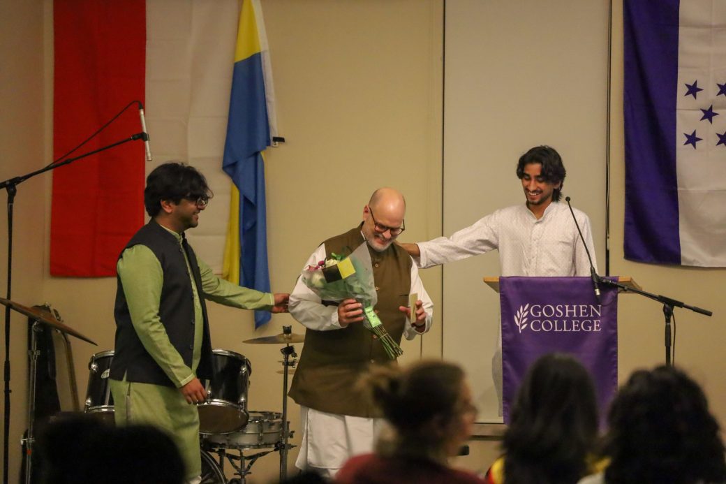 Goshen College students smiling with GC International Advisor