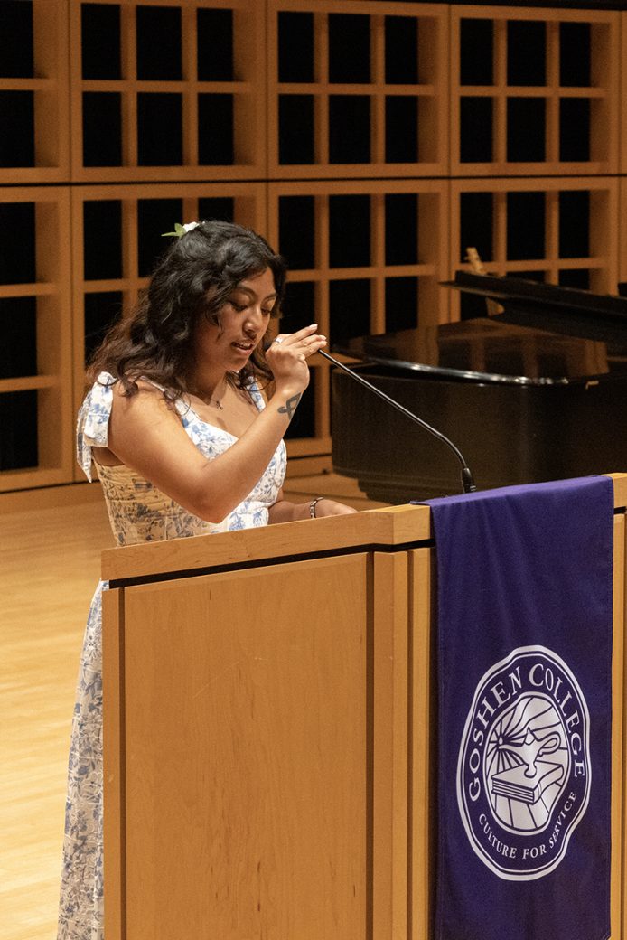 Goshen College student speaking to the people