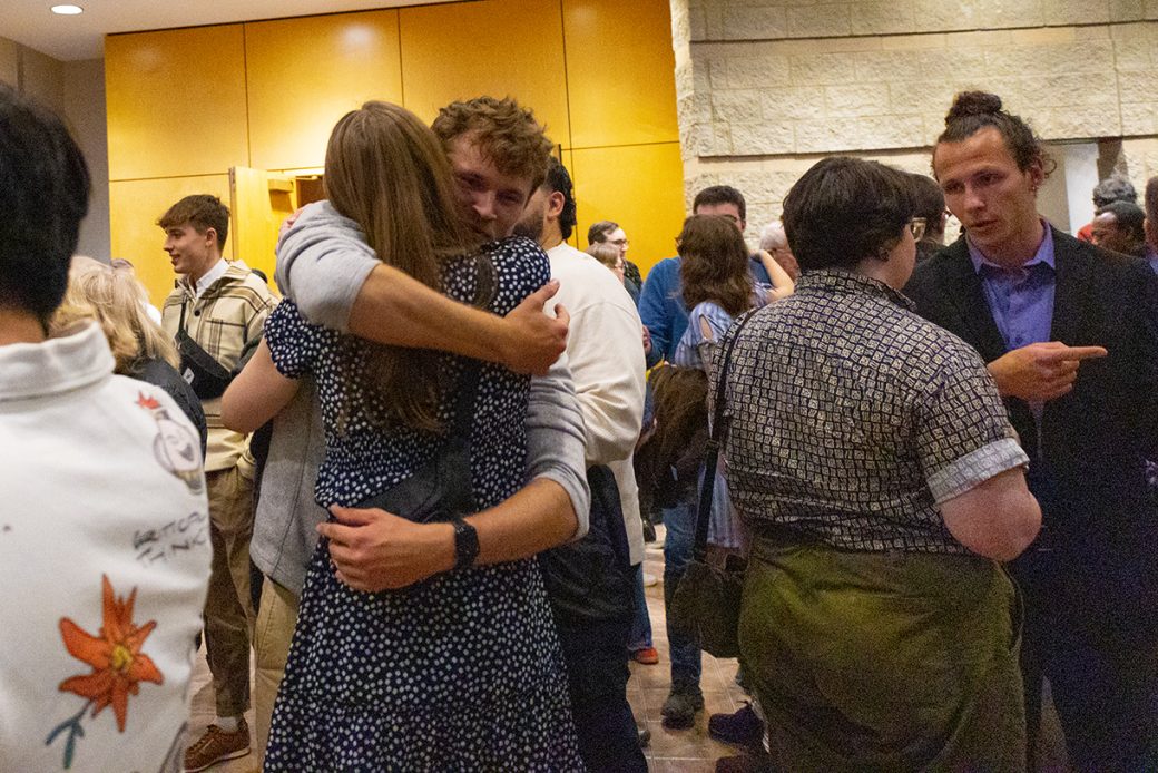 students hugging