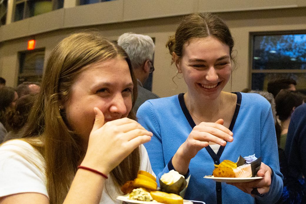students smiling during the dinner