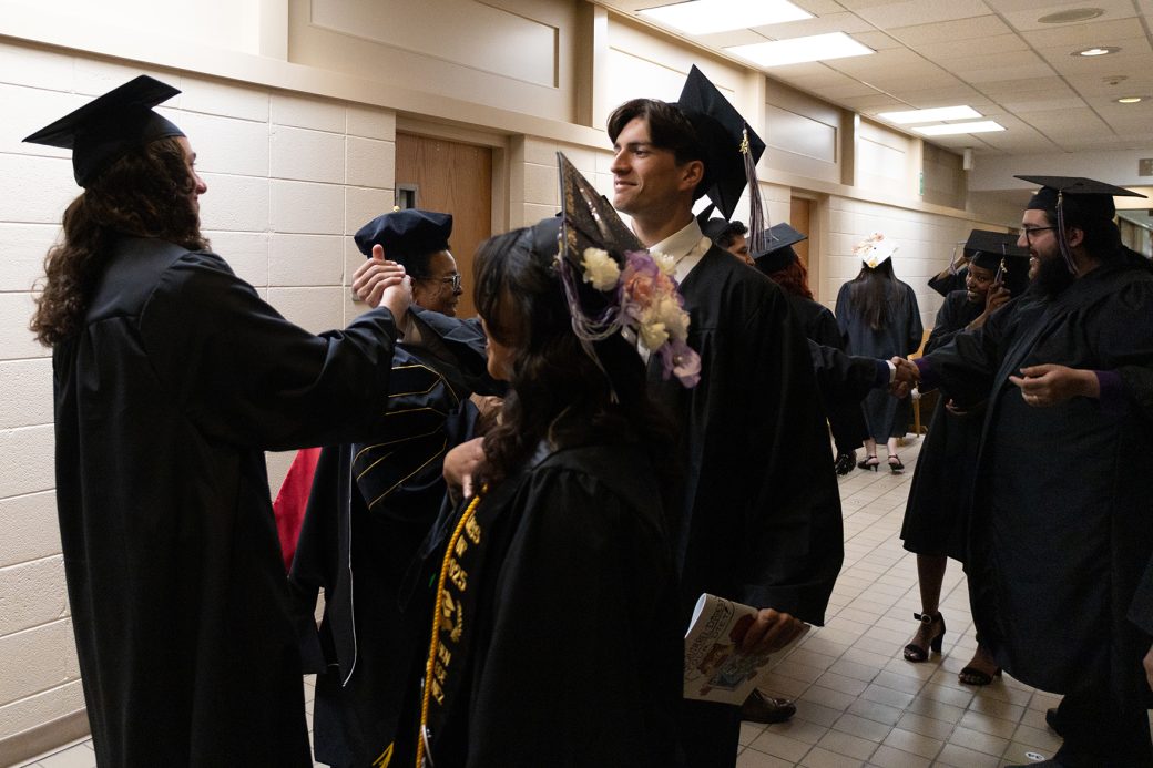 students shaking hands