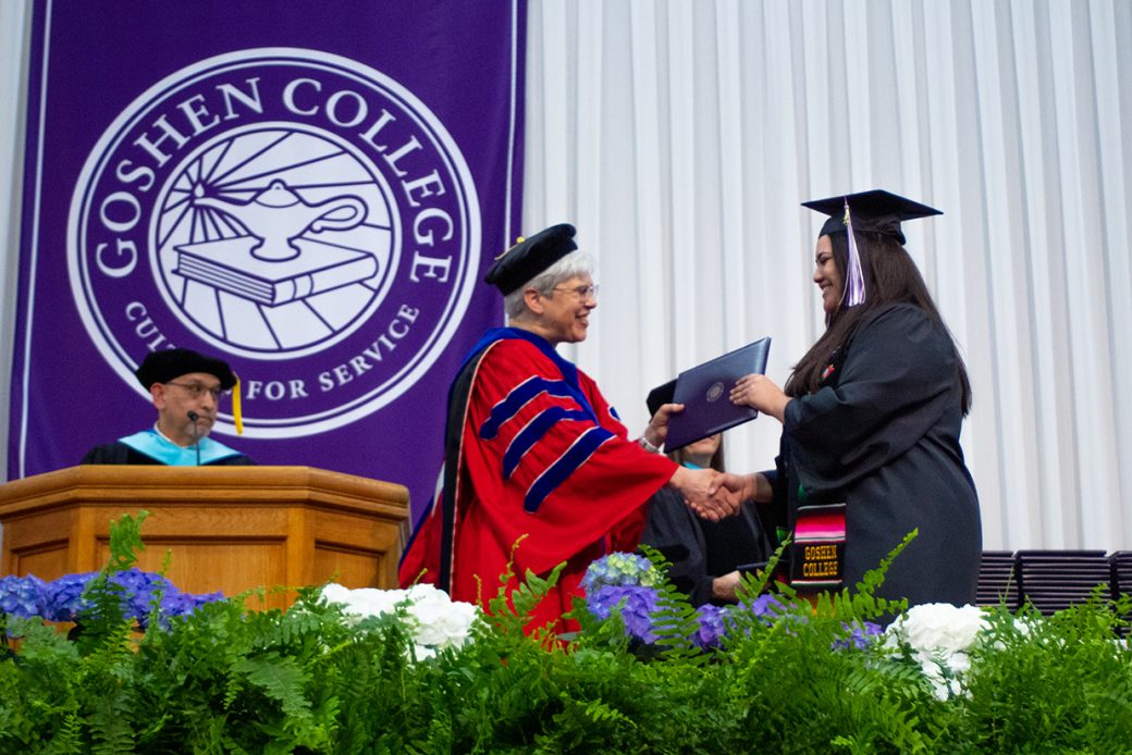 A student receiving her degree from Goshen College President