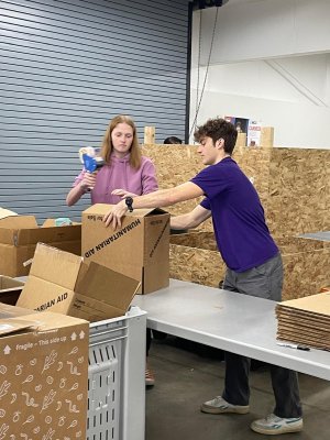 students working with cardboard boxes