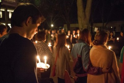 Students praying infront of fountain