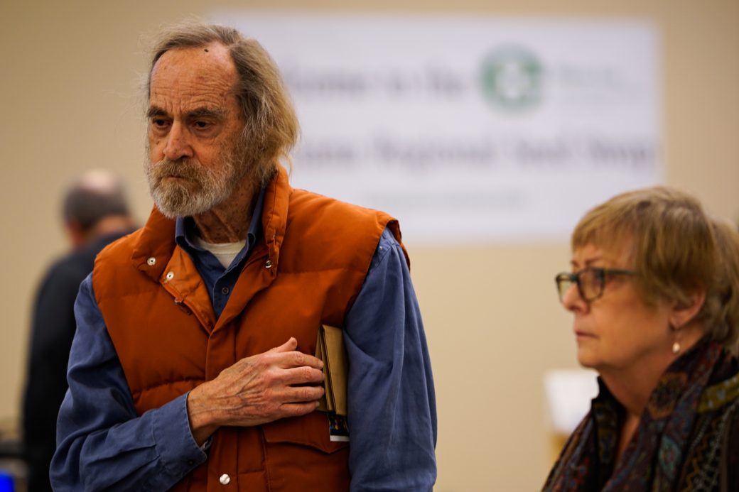 Man with a book at Michiana Regional Seed Swap