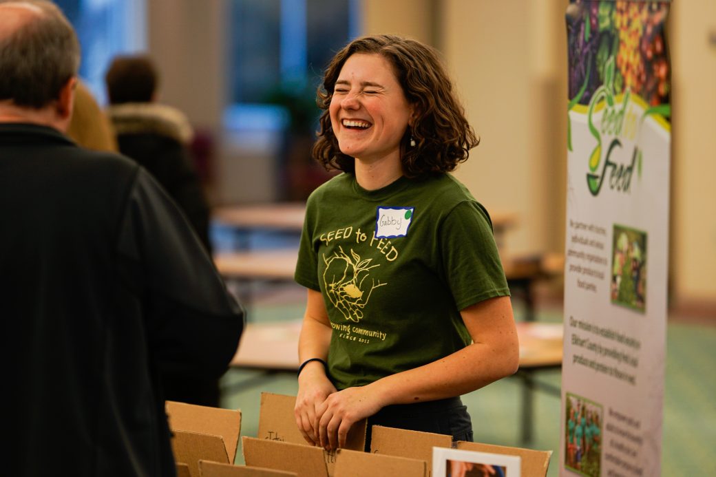 Woman smiling and doing a board presentation