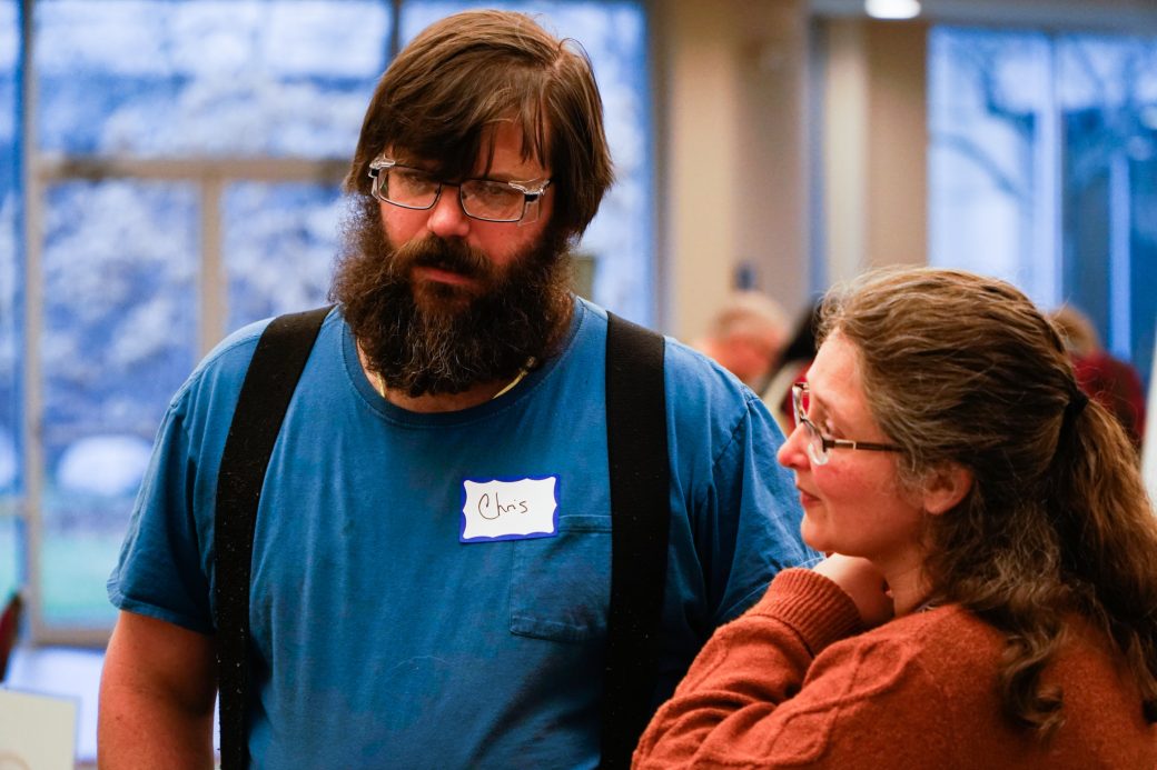 A man and a woman taking at Michiana Regional Seed Swap