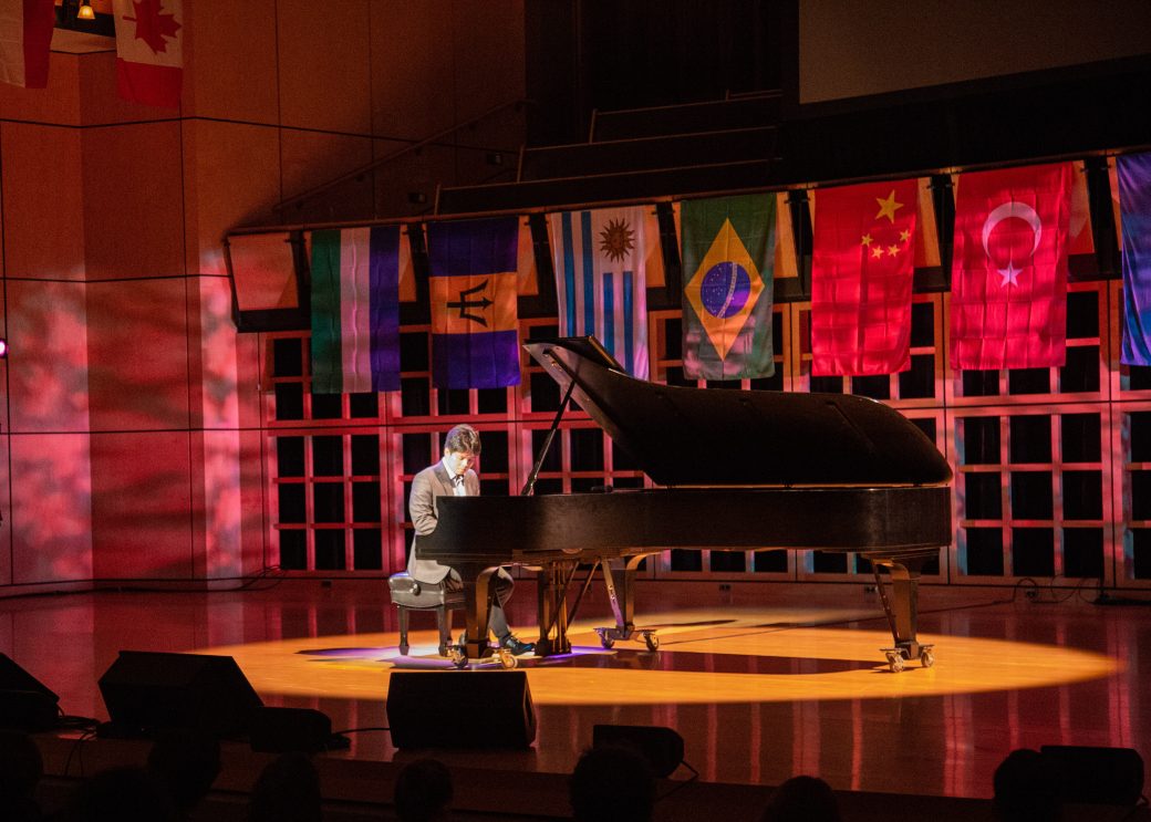 Man playing piano at International Student Club Coffeehouse 2023