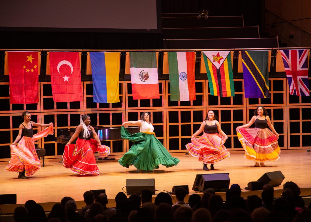 Five women dancing on the stage at International Student Club Coffeehouse 2023