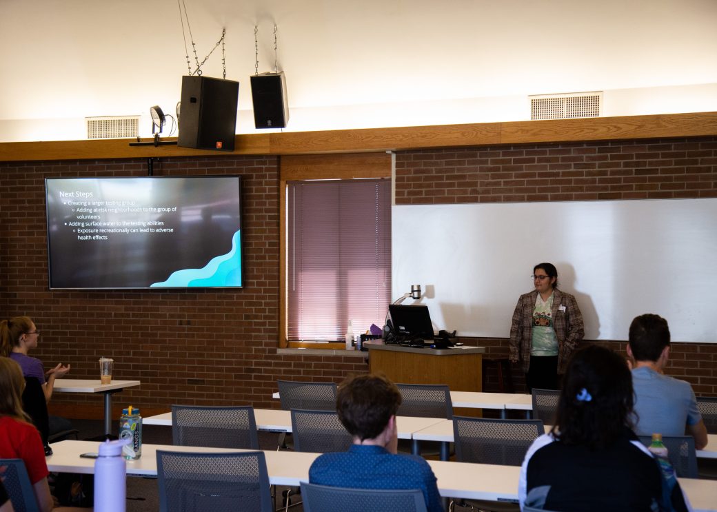 Woman doing a presentation at Academic Symposium 2023