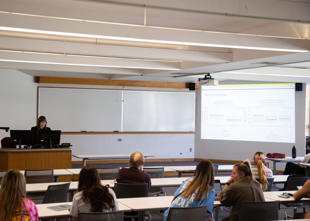 Woman doing a presentation at Academic Symposium 2023