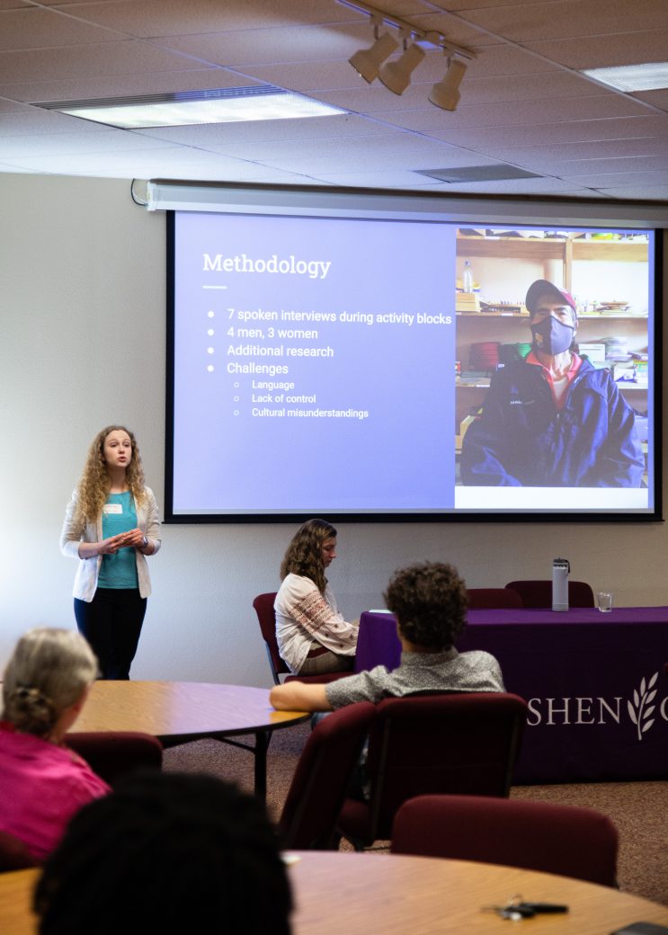 Woman doing a presentation at Academic Symposium 2023