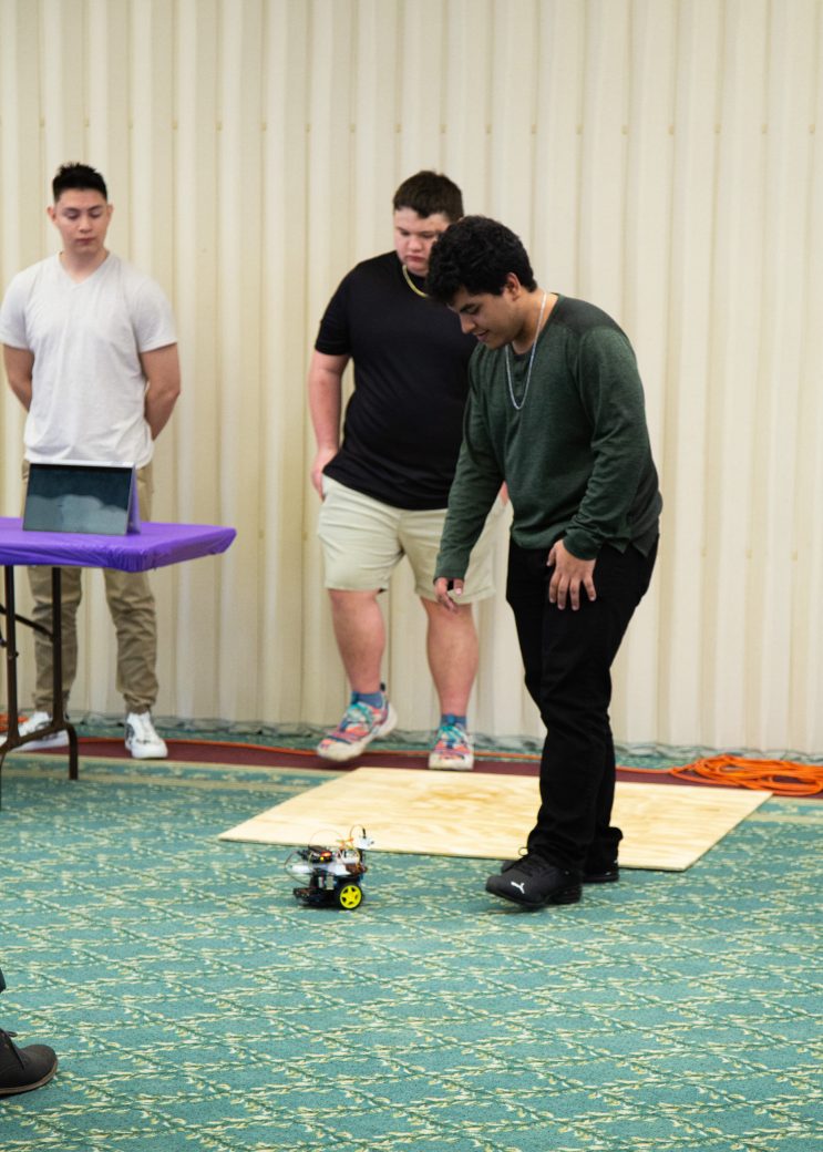Man playing with a eletronic toy with two wheels