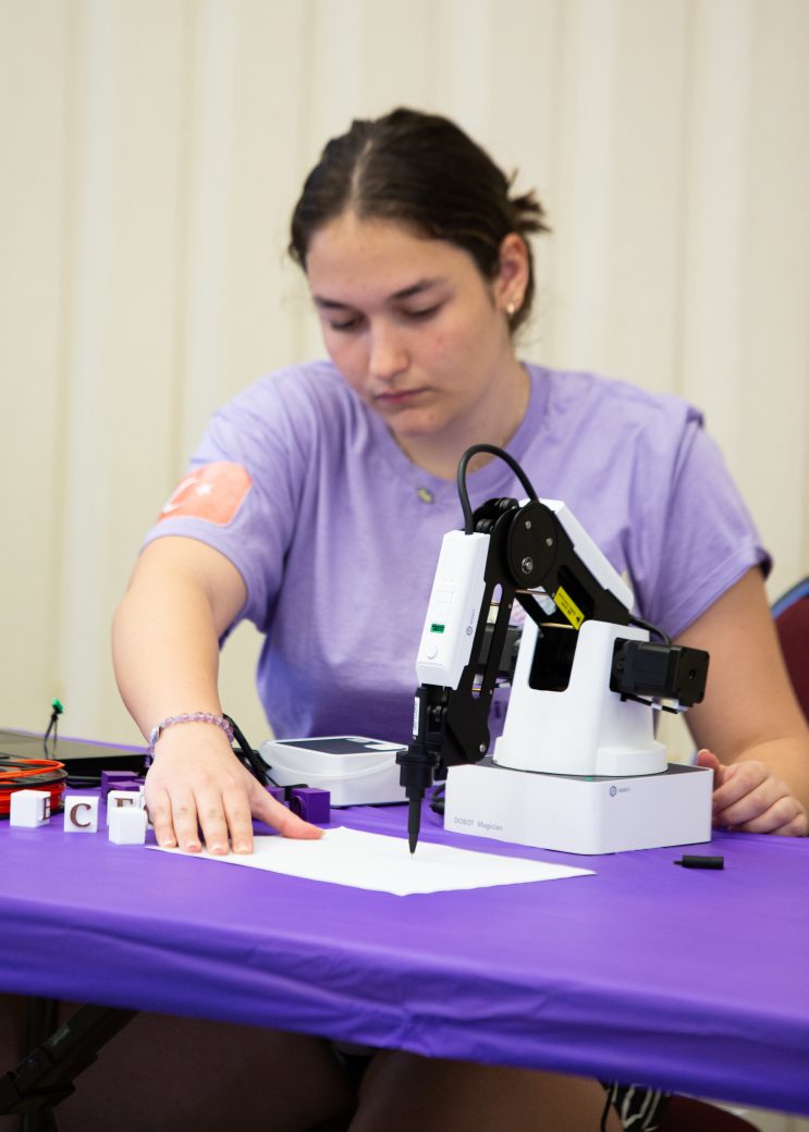 Woman looking using a eletronic write machine