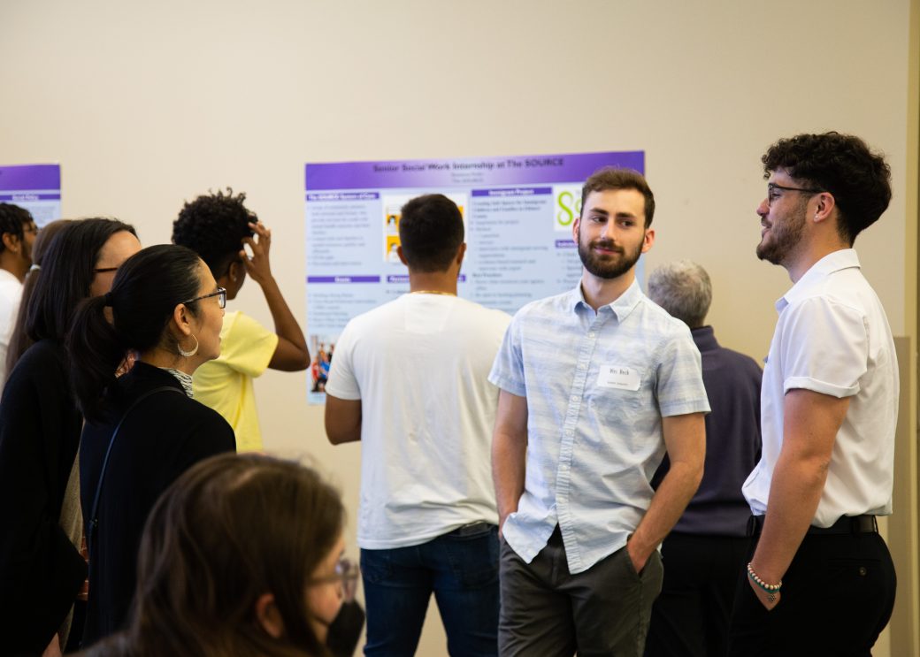 People looking in a presentation at Academic Symposium 2023