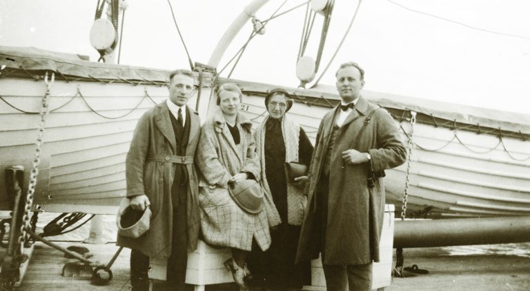 People in front of a boat
