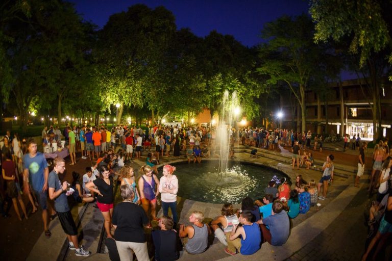 Students gathered around campus fountain