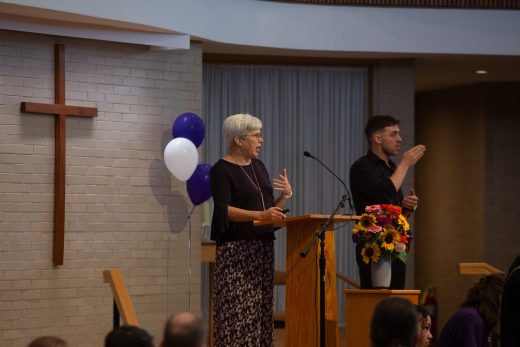 Woman doing a speech at the the pulpit