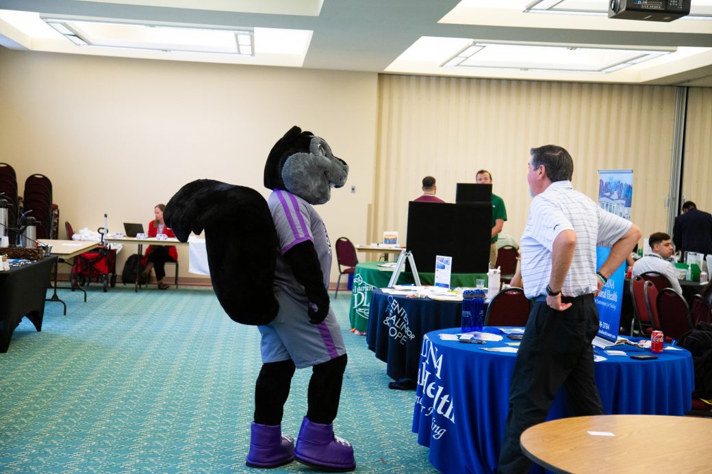Dash talking with a man