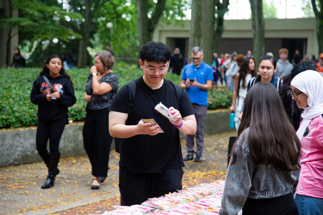 A man buying something at Hispanic Heritage Month Convocation and CelebrationHispanic Heritage Month Convocation and Celebration