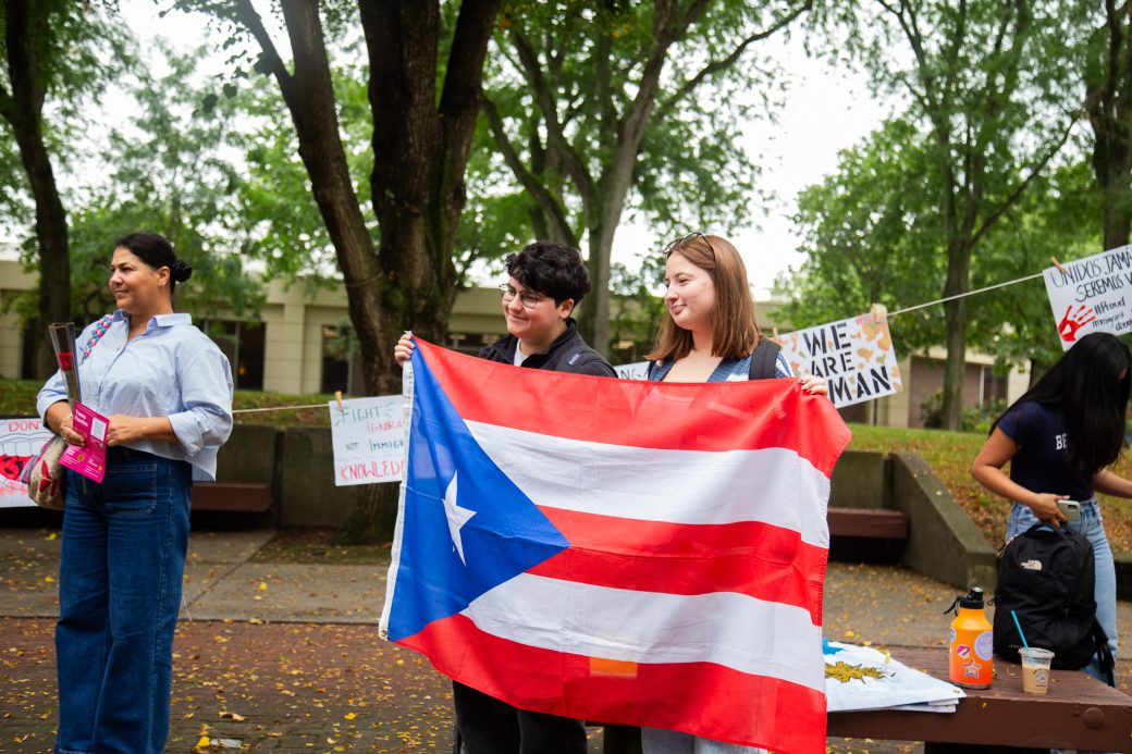People with Puerto Rico's flag at Hispanic Heritage Month Convocation and Celebration