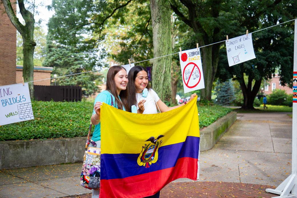 People with Equador's flag at Convocation and Celebration